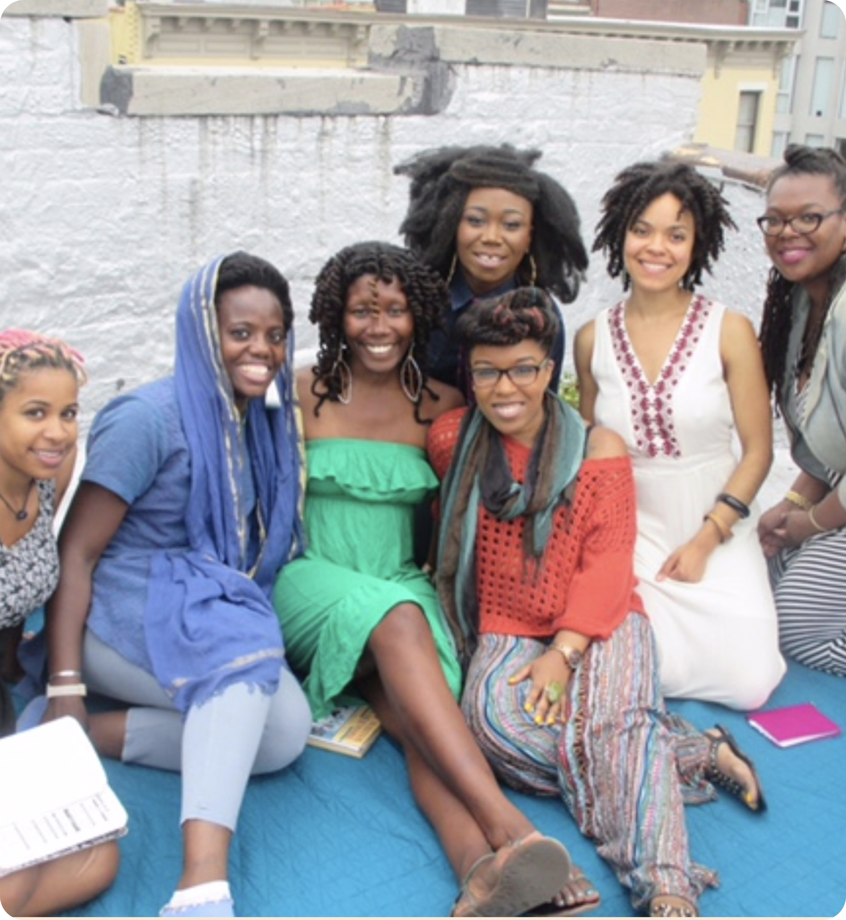 Nicole Dennis-Benn and Stuyvesant Writing Workshop participants on a roof top meeting.